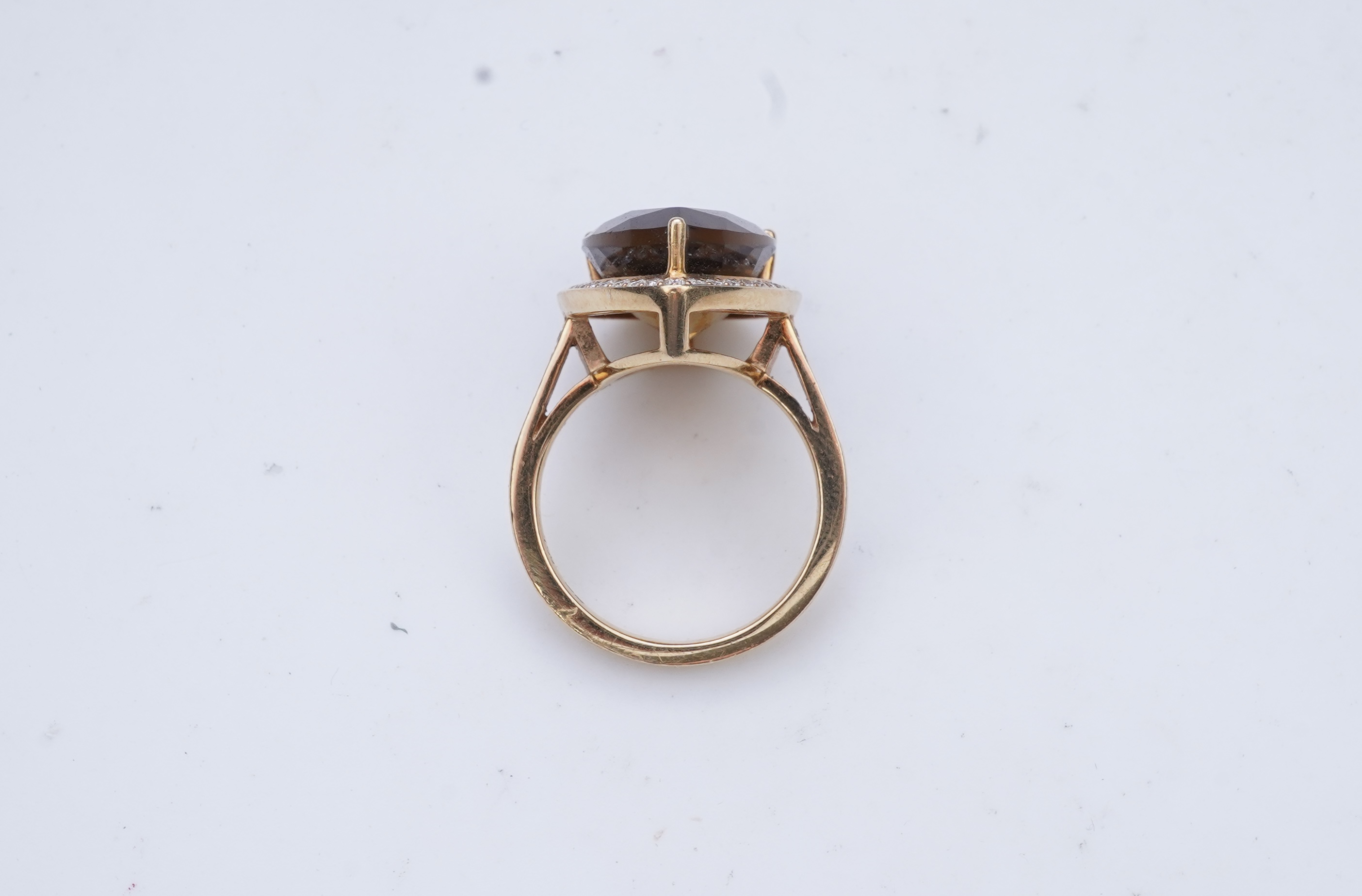 A smoky quartz and diamond ring